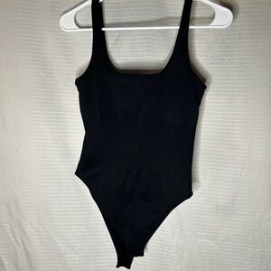 Waist cinching body suit